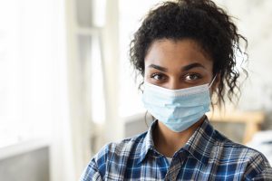 front-view-woman-with-medical-mask-copy-space